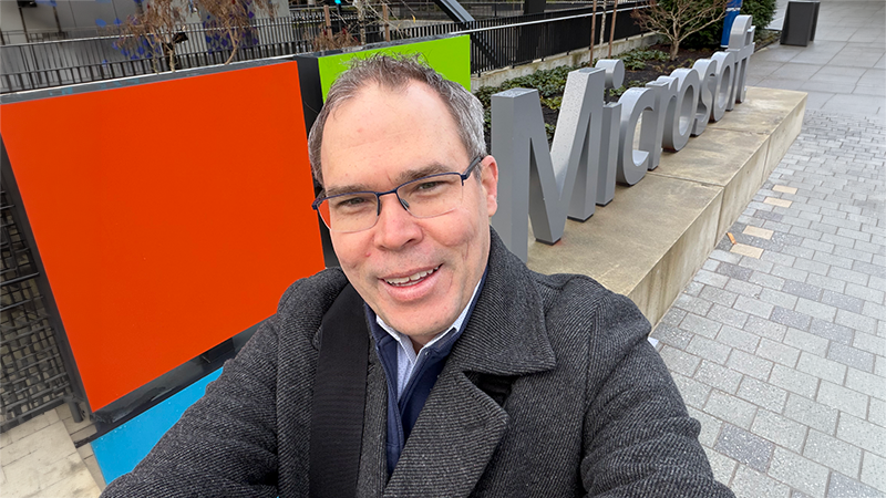 Adam Harmetz in front of a Microsoft sign