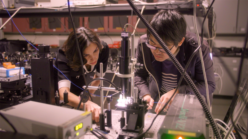 Professor Mona Jarrahi (left) working with her doctoral student Yifan Zhao (right) on the terahertz photonic chip