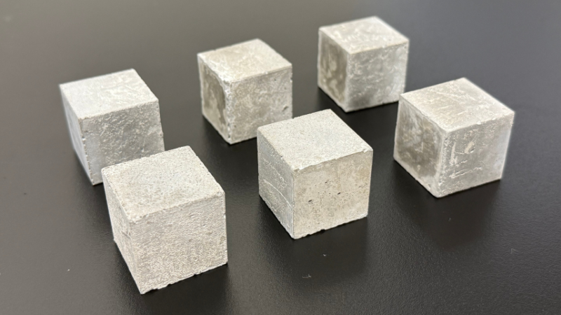 six small cubes of cement test samples